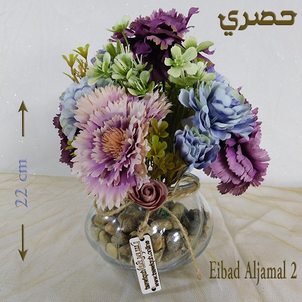 Glass bowl artificial flowers with mixed roses and gerberas in clear vase