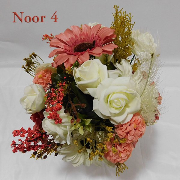 Glass vase flower arrangement with pink roses, white roses, and gerberas in clear glass vase