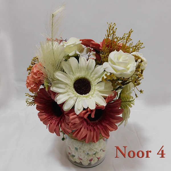 Glass vase flower arrangement with pink roses, white roses, and gerberas in clear glass vase