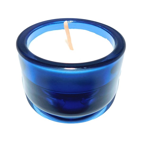 Scented candle in glass with multi-color holders and essential oils