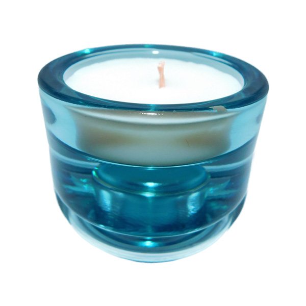 Scented candle in glass with multi-color holders and essential oils