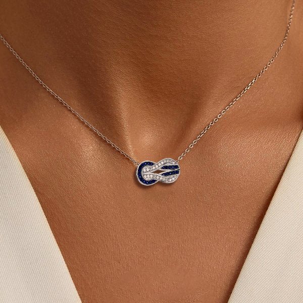 Infinity Necklace Italo sapphire worn on model décolletage with delicate silver chain