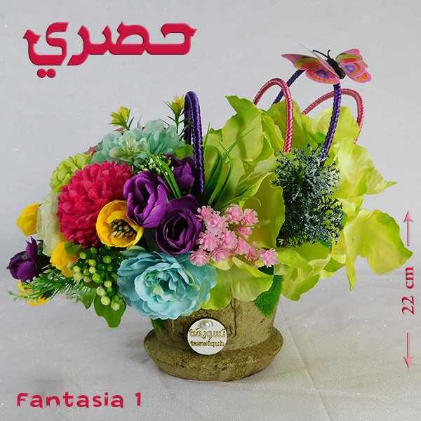 Fantasia bouquet in artisan pottery vase with imported blooms and nigella finish