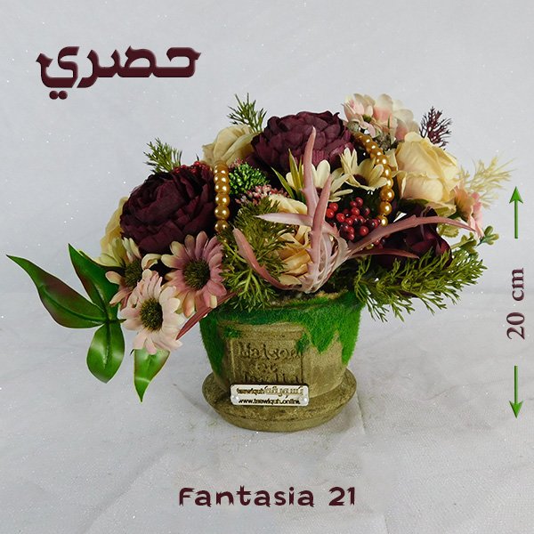 Fantasia bouquet in artisan pottery vase with imported blooms and nigella finish