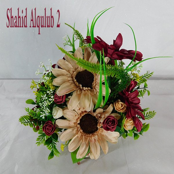 Shahid Alqulub sunflower bouquet in small glass vase with imported blooms and variable design options