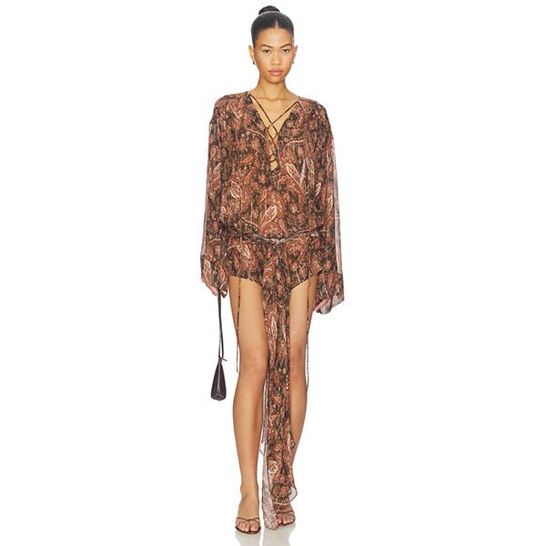 "The Andamane Indira mini dress in paisley sheer plisse fabric featuring front lace-up detail, waist ties, and subtle metallic threads"