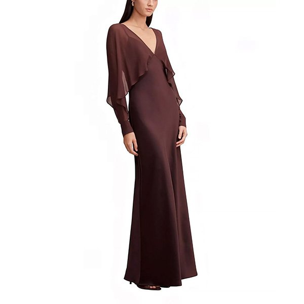Dark chocolate maxi dress detail showing sheer cape overlay and satin fabric