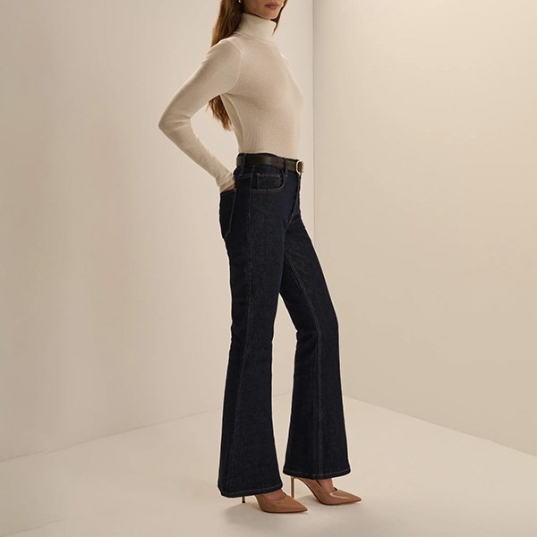 Flare Jeans Favorite Daughter The Maurice side view showing slim thigh and 22in flare opening