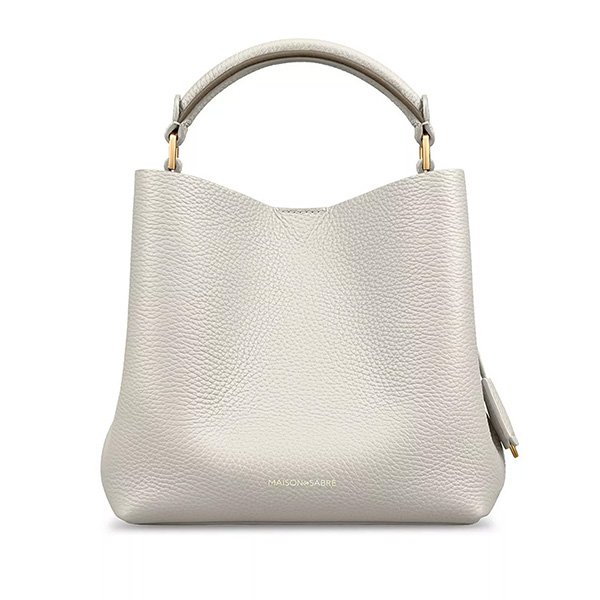 Foam Cashmere mini bucket bag showing cream beige leather with contrast handle and premium cotton lining