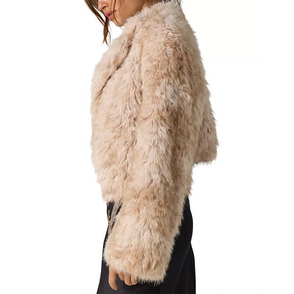 Ivory faux fur jacket side view showing cropped fit and plush texture