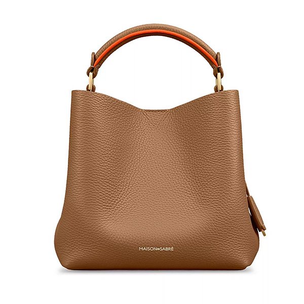 Manhattan Sandstone mini bucket bag showing tan brown leather with orange contrast handle and pebbled texture