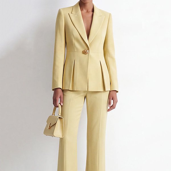 Two Piece Suit Zapaka yellow close-up of peak lapel, ornate gold button and front pleats