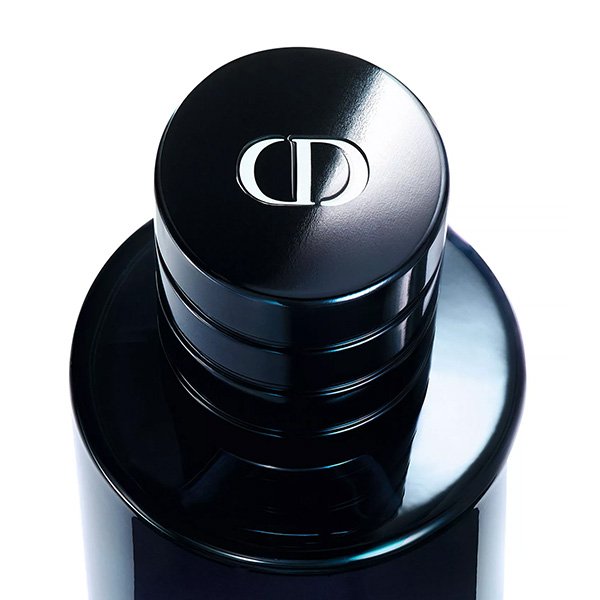 Dior Cologne Sauvage Parfum magnetic cap macro shot with engraved CD emblem