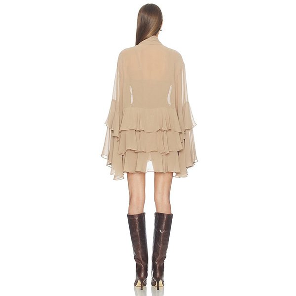 Mini Dress Camila Coelho Taja Taupe back view showing tiered ruffles and cape sleeves with brown boots